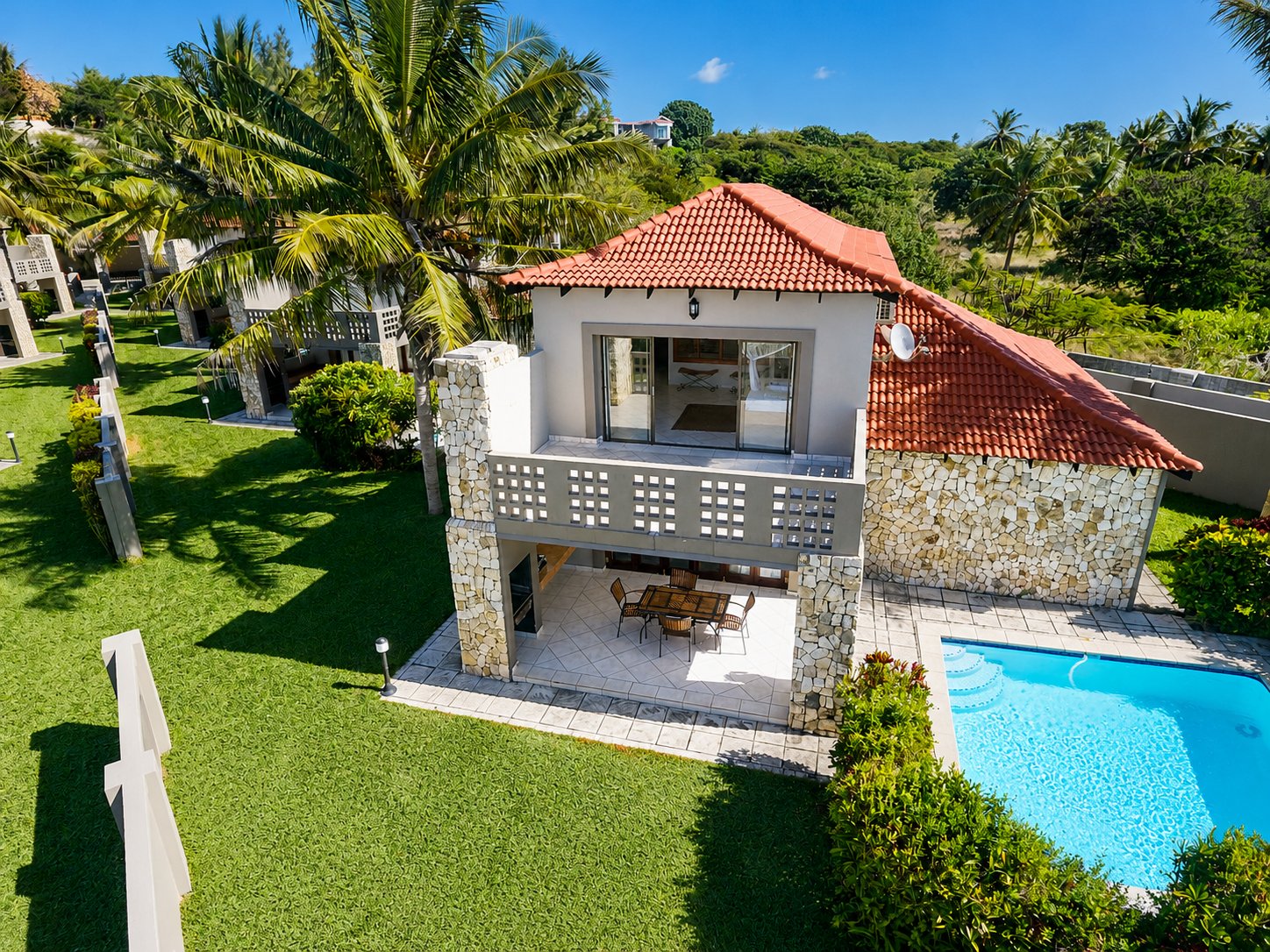 Aerial view of the unit exterior and private pool