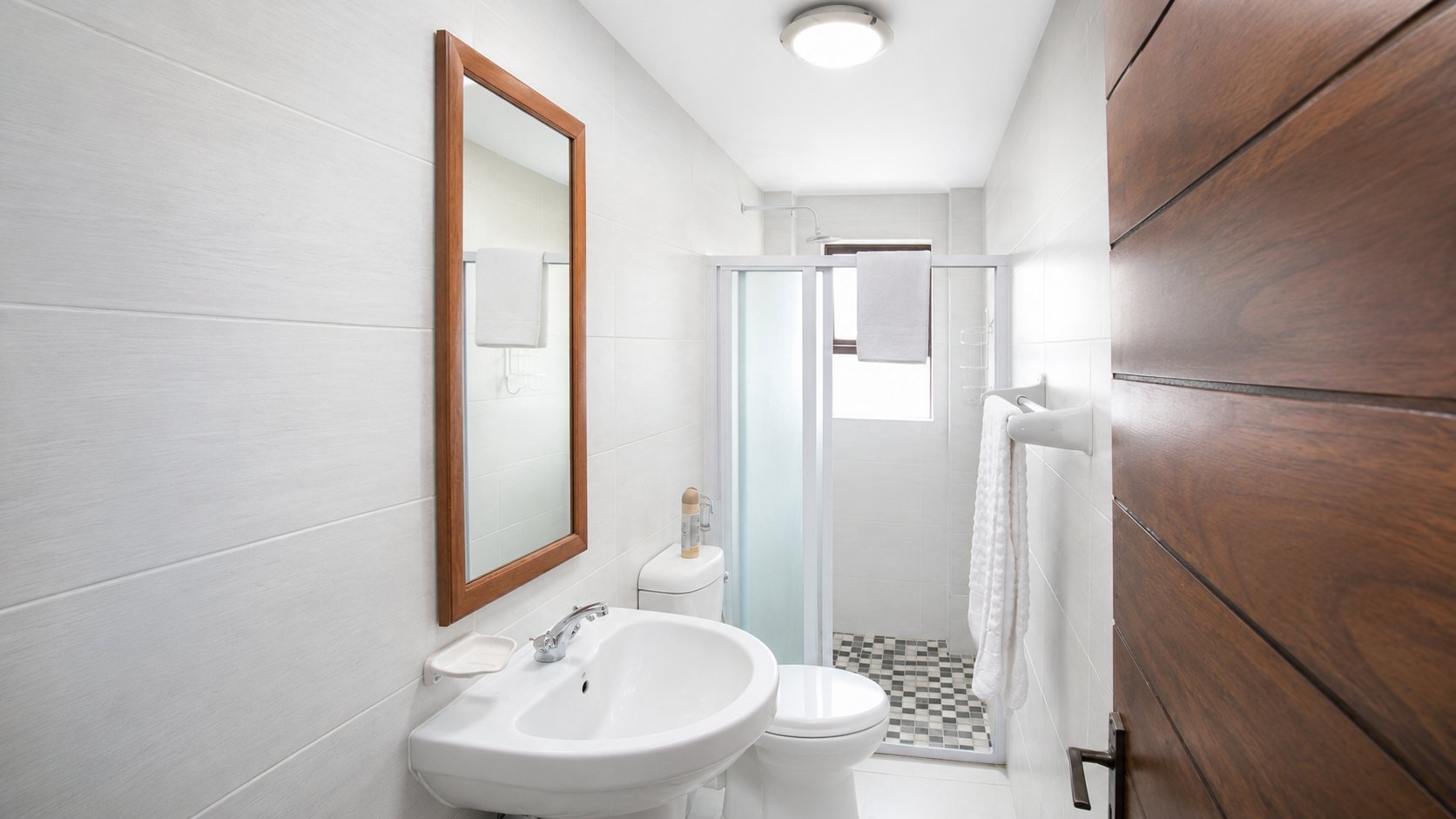 Bathroom with vanity mirror and walk-in shower