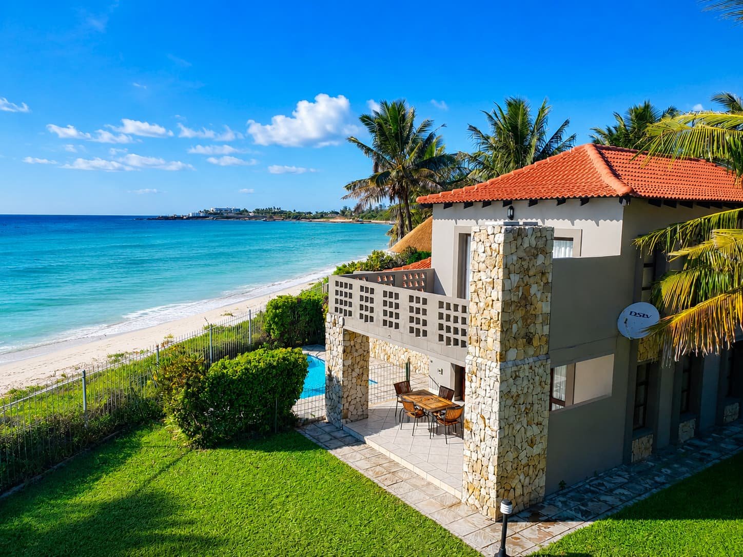 Aerial beachfront view with private pool and ocean