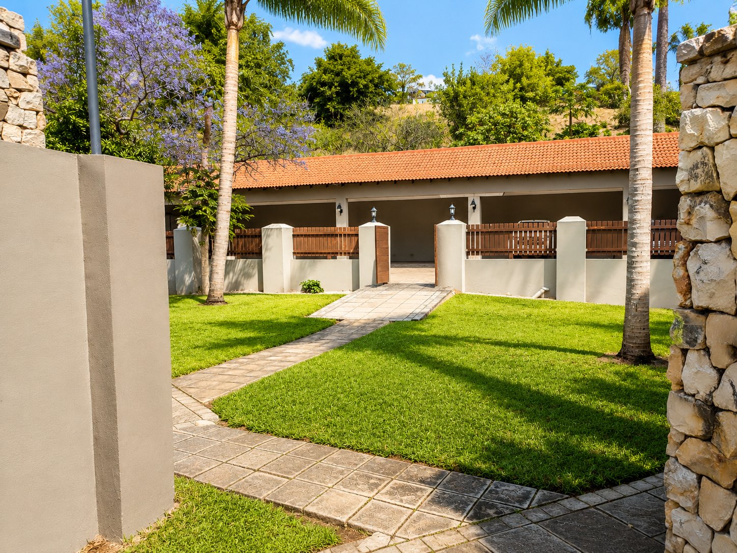 Garden pathway leading to the covered carport